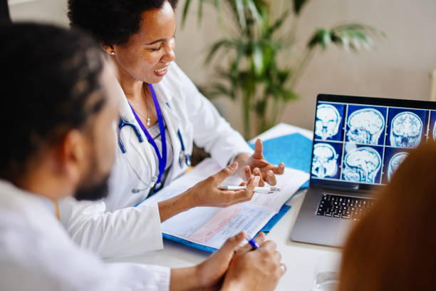 istock Radiologist reading a CT scan to a group of medical practitioners 1363098007