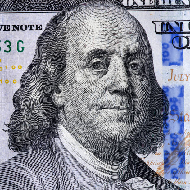 istock Benjamin Franklin on a one hundred dollar bill 1363100035