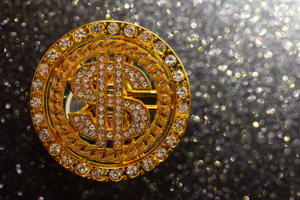 istock golden dollar sign with gemstones on black  glitter background 1363101524