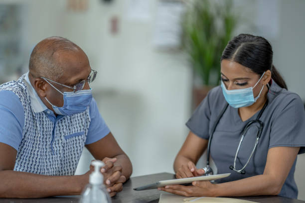 istock Reviewing Test Results with a Patient 1363101623