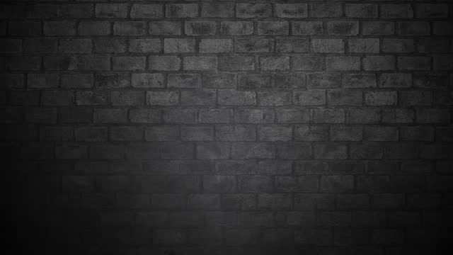 dark black brick wall with smoke and spotlight effect for presentation purposes background footage