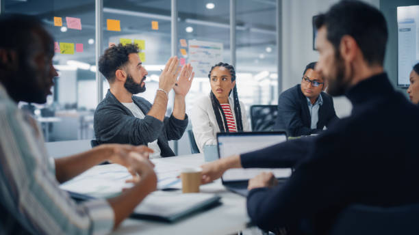 istock Multi-Ethnic Office Conference Room Meeting: Diverse Team of Creative Entrepreneurs, Specialists, Professional Talk, Discuss Growth. Businesspeople work on Digital e-Commerce Startup. 1363104971