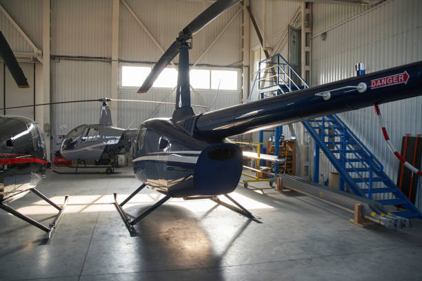 istock Three unmanned choppers housed in closed metal hangar 1363105396