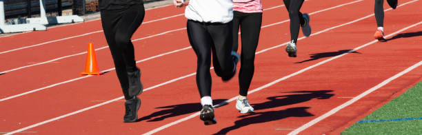 istock Runners training on a track in a group in the cold 1363106253