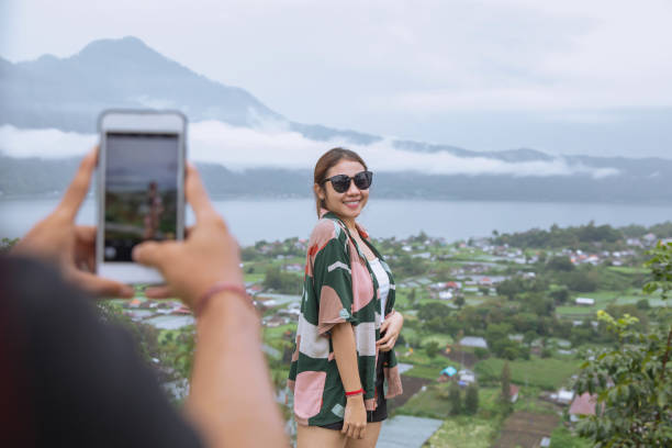 Insta Boyfriend Photographing Girlfriend with Mountain View