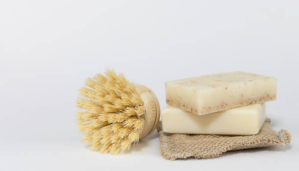 istock Two pieces of solid soap with brush and sponge 1363107920
