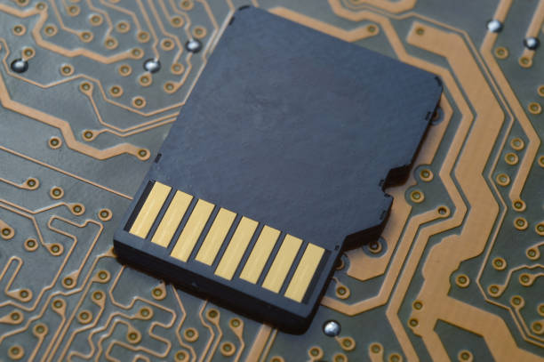 istock the black micro sd card lies on the microcircuit. close-up. 1363107996