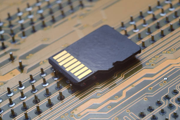 the black micro sd card lies on the microcircuit. close-up