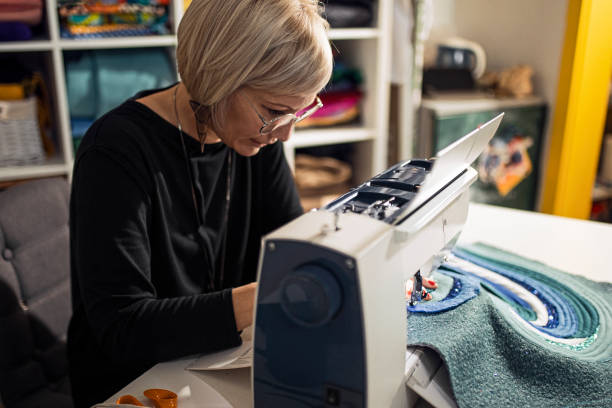 Tailor designer using sewing machine