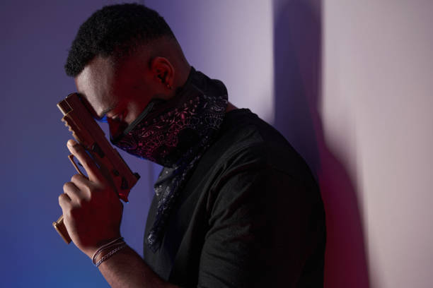 istock Male bringing handgun to his face and brooding 1363110318