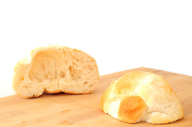 Italian bread rosetta cut in two part stock photo