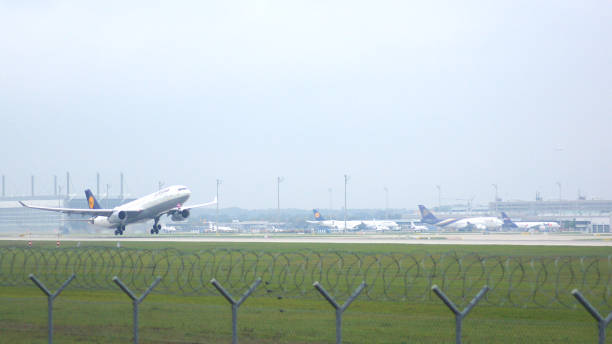 Lufthansa Airbus A330-343 takeoff the northern runway of the Munich airport MUC EDDM Munich, Germany - 11 October 2015: Lufthansa Airbus A330-343 takeoff the northern runway of the Munich airport MUC EDDM. munich airport stock pictures, royalty-free photos & images