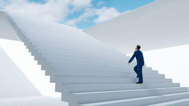 istock Man takes a big step on staircase leading to the light above 1363114449