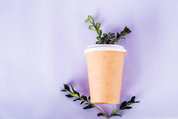 istock coffee cup of reusable materials with green twig on Very Peri background. zero waste concept. replacement for plastic cups 1363114620
