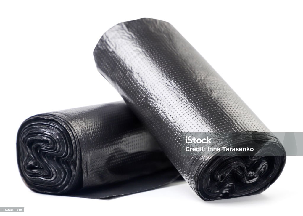Roll of garbage bags on a white background. Isolated Roll of garbage bags close-up on a white background. Isolated Garbage Bag Stock Photo