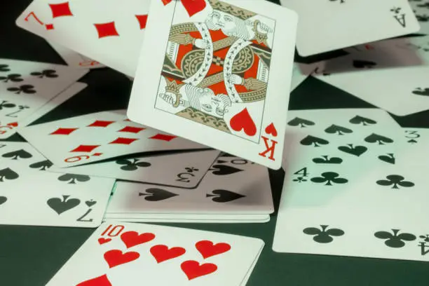 Playing cards falling to the ground