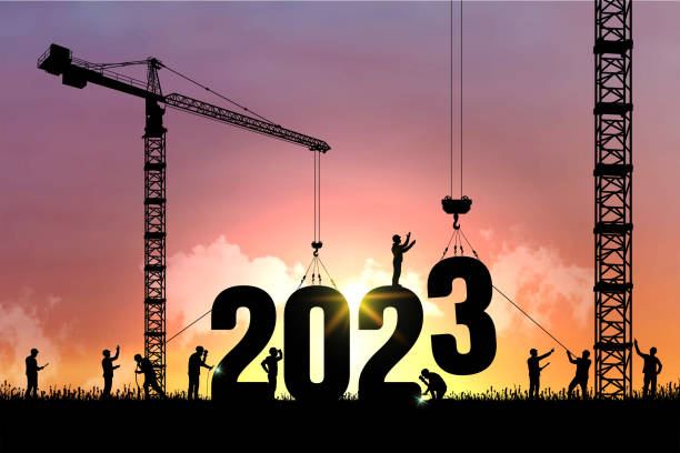 istock Black vector silhouette of construction worker with crane and sky for preparation of welcome 2023 New Year party and change new business. Businessman engineer looking 2023 blueprint in a building site. 1363119674