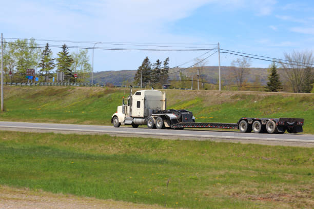 istock Semi-truck with a flatbed trailer 1363119795