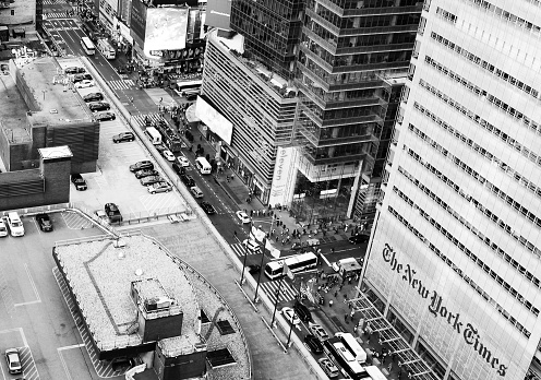 Barbican Estate, The City of London, England, United Kingdom, Great Britain - 8th of January, 2024: This aerial photograph shows a view of London from above. The photo presents the urban landscape of the city, including famous landmarks: Some features that can be seen are the Shakespeare Tower, Cromwell Tower, and Lauderdale Tower, which are part of the iconic Barbican Estate. These tall residential towers were built in the Brutalist architectural style. \n\nAlso visible are the Golden Lane Estate and Barbican Centre arts complex. Additional points of interest in the distance include Moorgate area and views towards Bishopsgate. This  London skyline offers a glimpse of London's skyscrapers silhouetted against the winter daylight sky.\n\nAn aerial photo shot presents a panorama of the United Kingdom's capital city, London, in broad daylight. The urban landscape of London City.