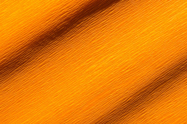 istock Wrinkled orange crepe paper background texture 1363120327
