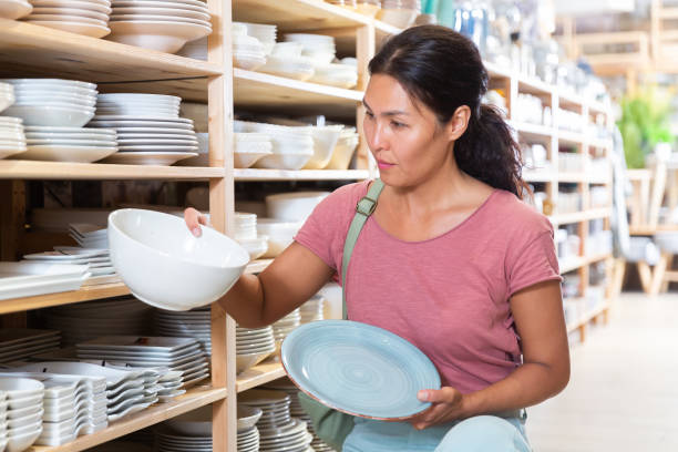 istock Woman electing plates in store 1363121380
