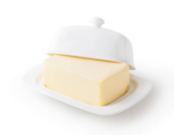 istock Fresh butter on white butter dish isolated on white background with clipping path 1363123090