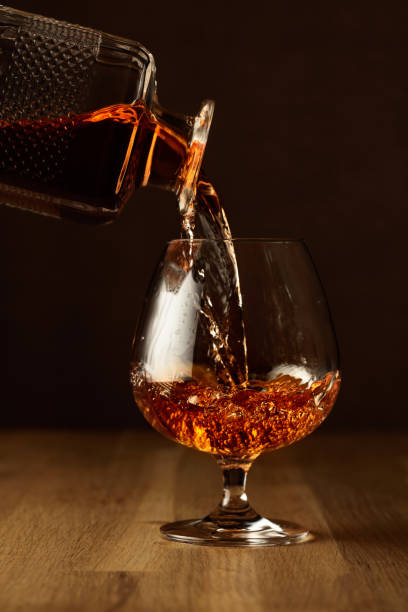 istock Brandy is poured into a snifter glass. 1363124425