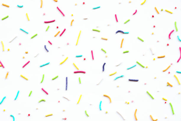 istock Multicolored rod-shaped sprinkles isolated on white paper background 1363124541