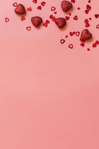 istock Valentines, love and wedding concept ideas. Frame red hearts on pink background. Flat lay, top view. Copy space. 1363124967