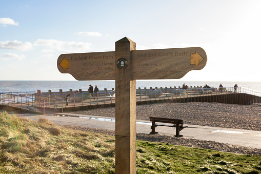 Seaford, East Sussex, England - 5 Jan 2022:  Coastal Signpost . Beware Cliff Edge. White Cliffs of the English Coastline.