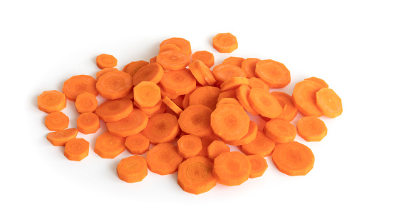 Bunch of sliced carrots isolated against white background