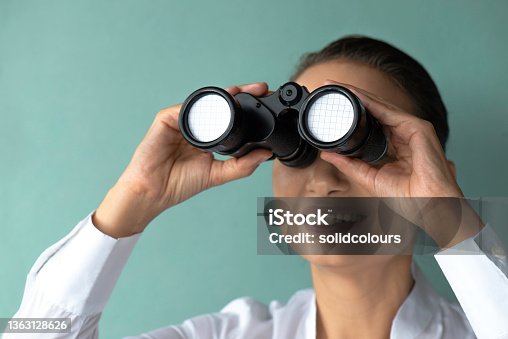 istock Businesswoman And Binoculars 1363128626