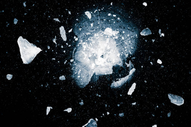istock Spreading shards of crushed ice on black background. 1363129299