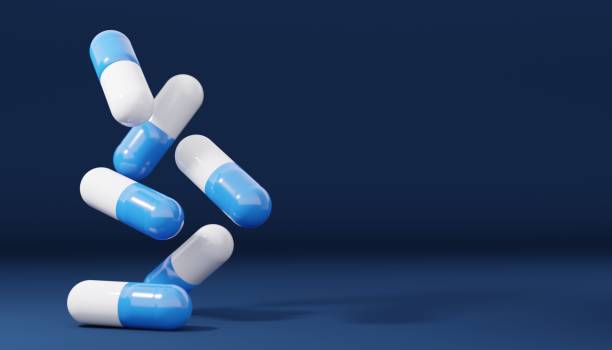 落ちる抗生物質ピルカプセルのグループ。ヘルスケアと医療の3dイラストの背景。医学の概念。スペースのコピー。 - vitamin capsule 写真 ストックフォトと画像