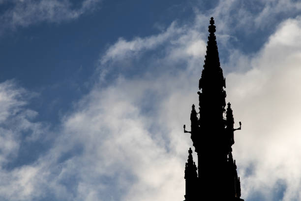 istock Silhouette of Scott Monument in Edinburgh Against a Blue Cloudy Sky 1363129454