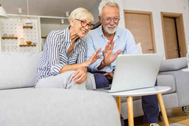 istock Senior couple using a laptop computer at home for video call. 1363129658