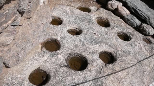 Ancient Indian Holes In A Large Stone For Processing Corn