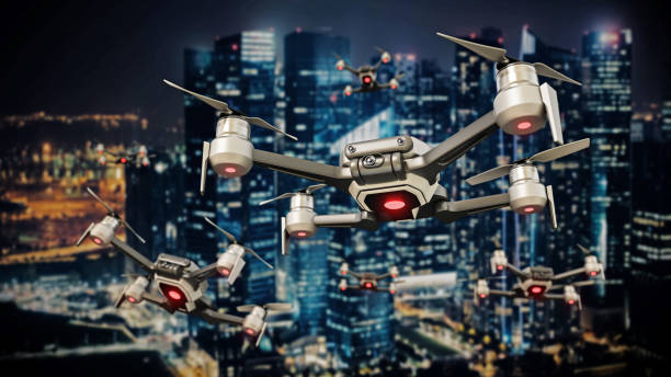 istock Group of drones flying against large modern city background 1363131034
