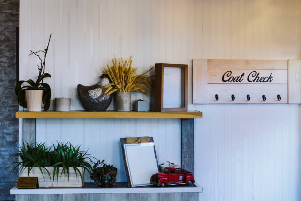 istock Shelves with decoration and plants. Coat check rack hanging on the white wall 1363134178
