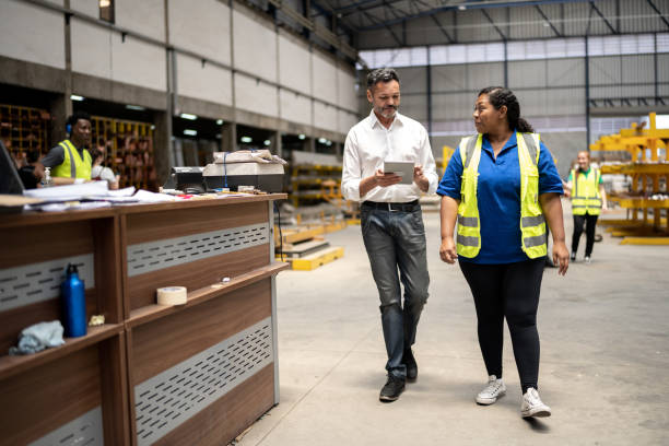 istock Manager and employee talking in a factory/industry 1363134675