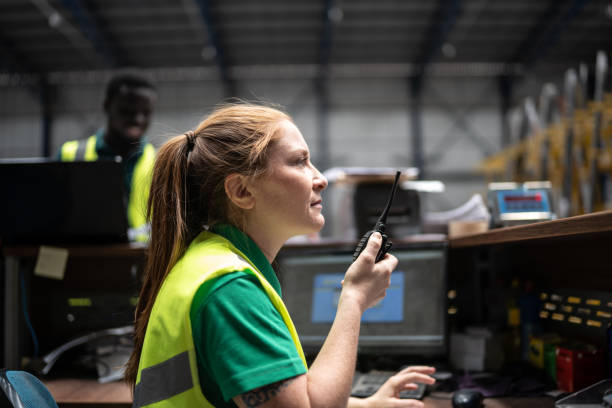 Employee using radio communication at factory/industry