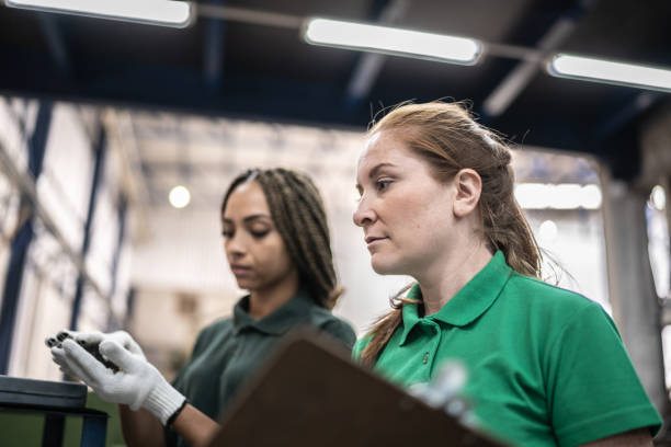 istock Inspector talking to production line worker in a factory/industry 1363134748