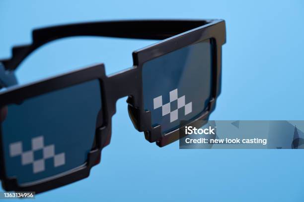 Funny Pixelated Boss Sunglasses On Blue Background Stock Photo - Download Image Now
