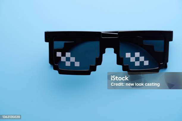 Funny Pixelated Boss Sunglasses On Blue Background Stock Photo - Download Image Now