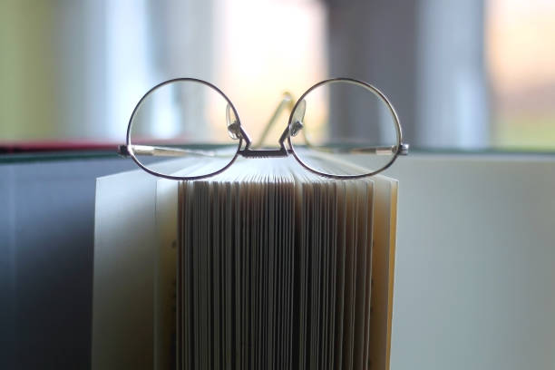 Hardcover Books and Reading Glasses