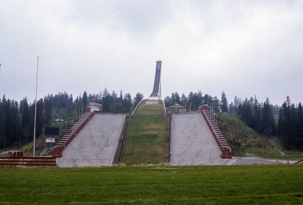 Innsbruck, Austria - March 21, 2025: Innsbruck Ski Jump Bergisel with Serles Mountain in the background.