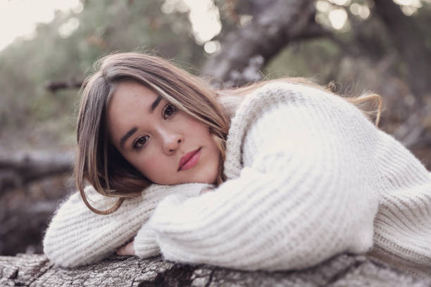 istock Female teen resting head on log 1363138130