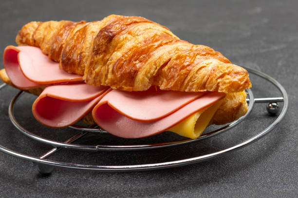 istock Croissant with ham and cheese. 1363138156