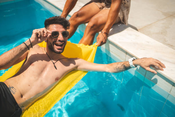 istock Gay couple in the pool 1363138350