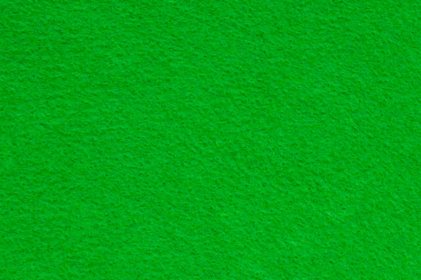 istock Vivid green wool felt texture for background 1363138712